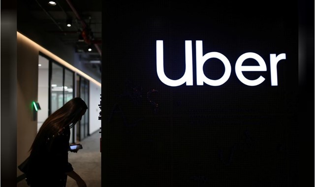 Logo của Uber được chụp tại văn ph&ograve;ng của h&atilde;ng ở Bogota, Colombia, Ảnh Reuters / Luisa Gonzalez